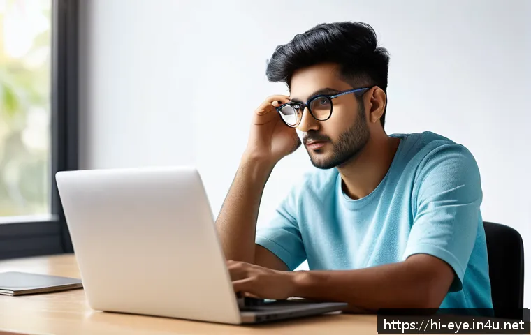 눈 건강 체크리스트 - A young Indian man sitting at a modern desk with a laptop, practicing the 20-20-20 eye care rule by ...